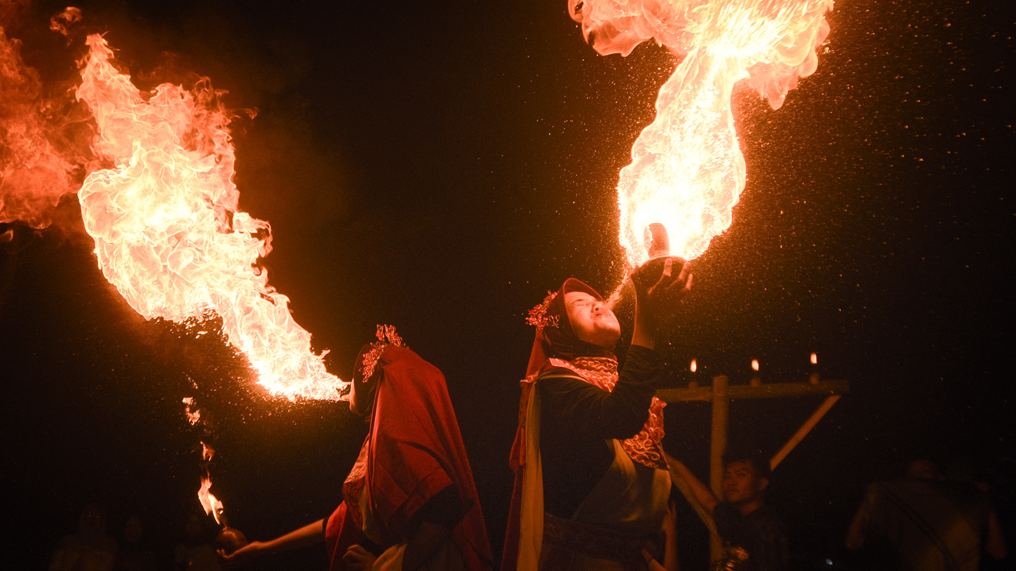 Fire breathers perform during celebrations marking the beginning of the Islamic New Year in Bandung, West Java