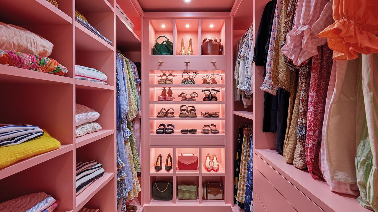 pink walk-in wardrobe with shoe storage and pink interior