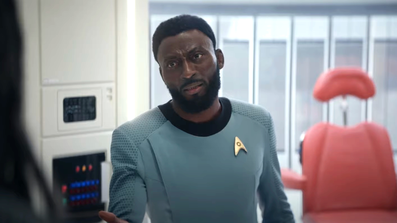 Babs Olusanmokun stands upset on the Enterprise in Star Trek: Strange New Worlds.