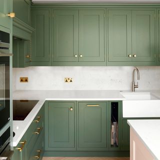 kitchen with olive green cabinets and butler sink