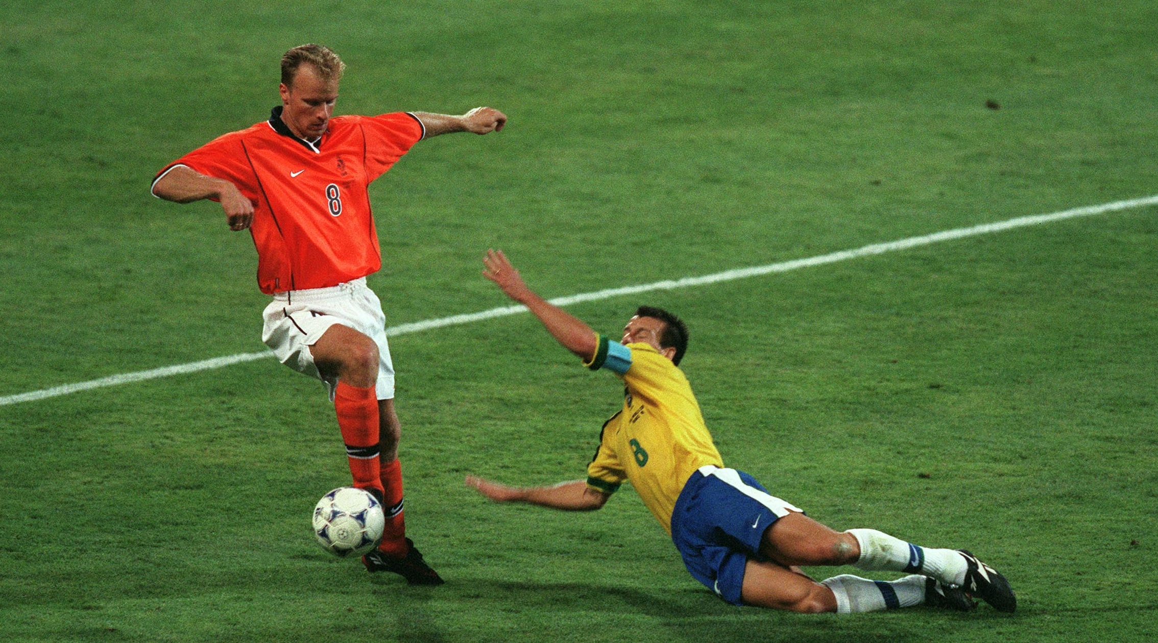 7/7/1998 Football World Cup 1998, Brazil v Holland (The Netherlands), Dennis Bergkamp skips around Dunga. (Photo by Mark Leech/Getty Images)
