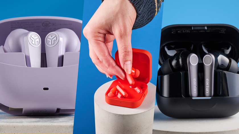 from left to right: the jlab go pods anc in lilac in the charging case, the cmf by nothing buds pro 2 in orange being taken out of the charging case, and the earfun air pro 4+ in the black charging case