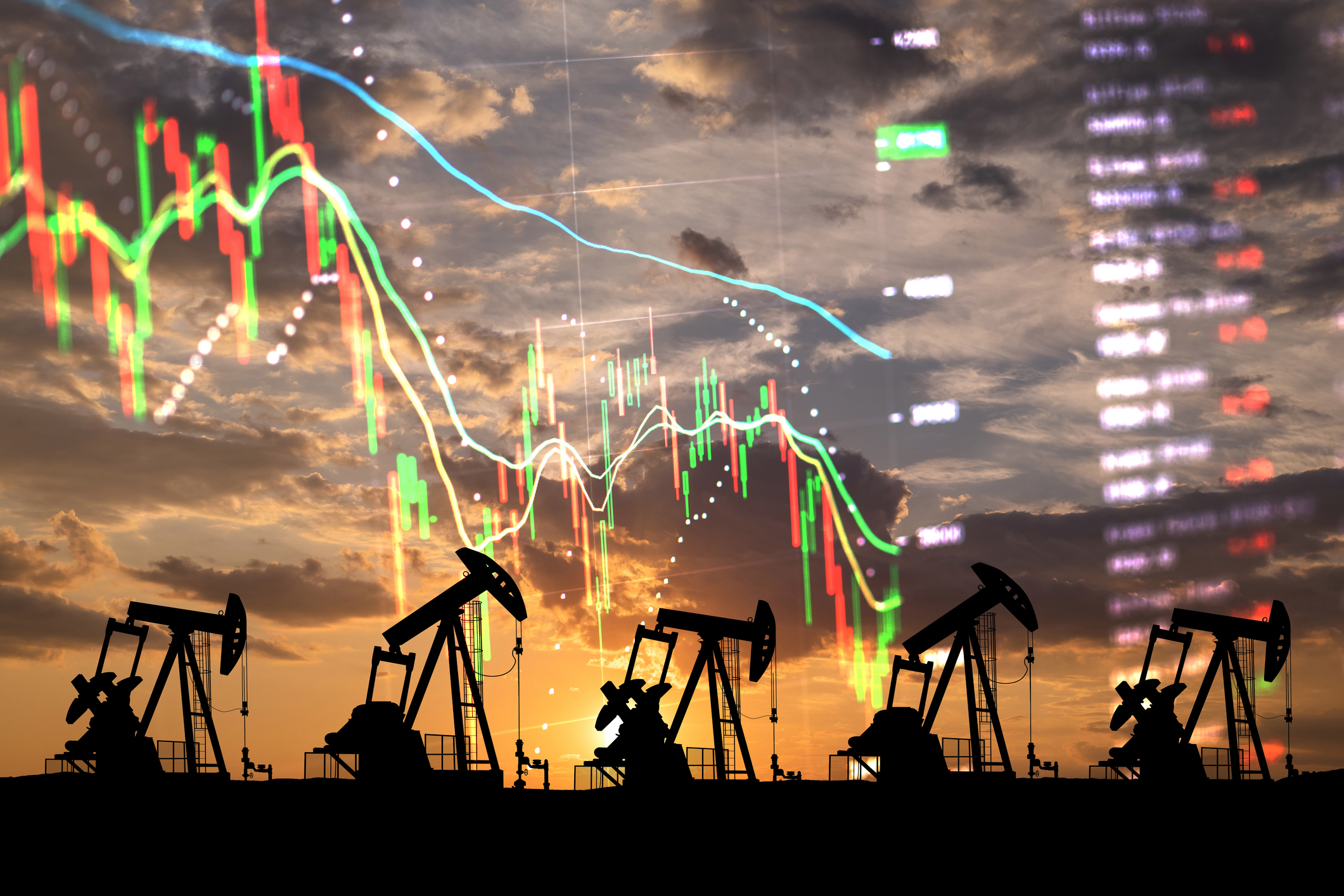 Oil rigs with financial charts superimposed over the top