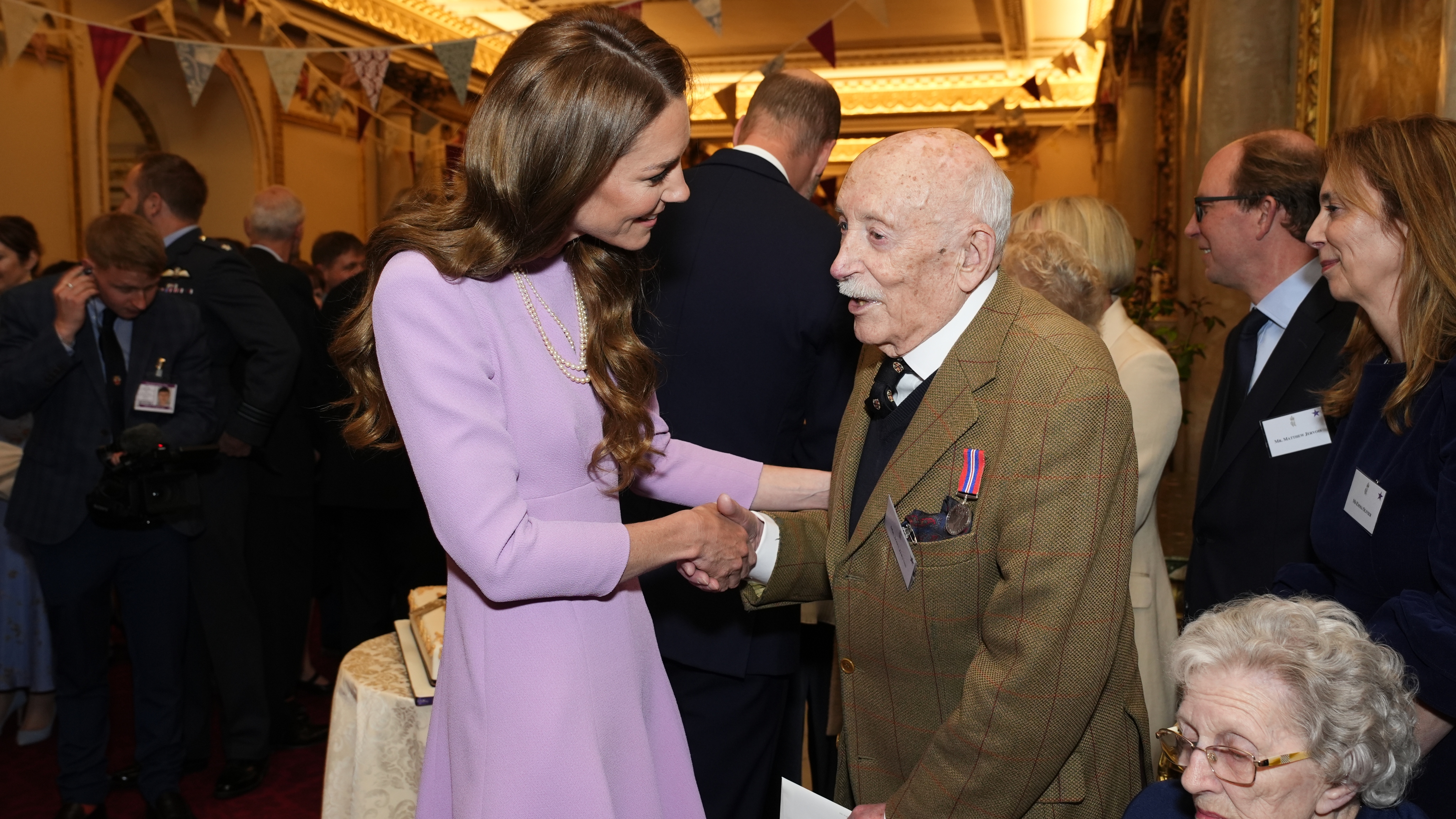 Catherine, Princess of Wales speaks with John Jervois as she attends a reception at Buckingham Palace, on the 100th anniversary of the birth of Queen Elizabeth II on April 21, 2026