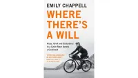 The front cover of Where There's A Will, complete with woman riding a bikepacking bike through a mountainous landscape