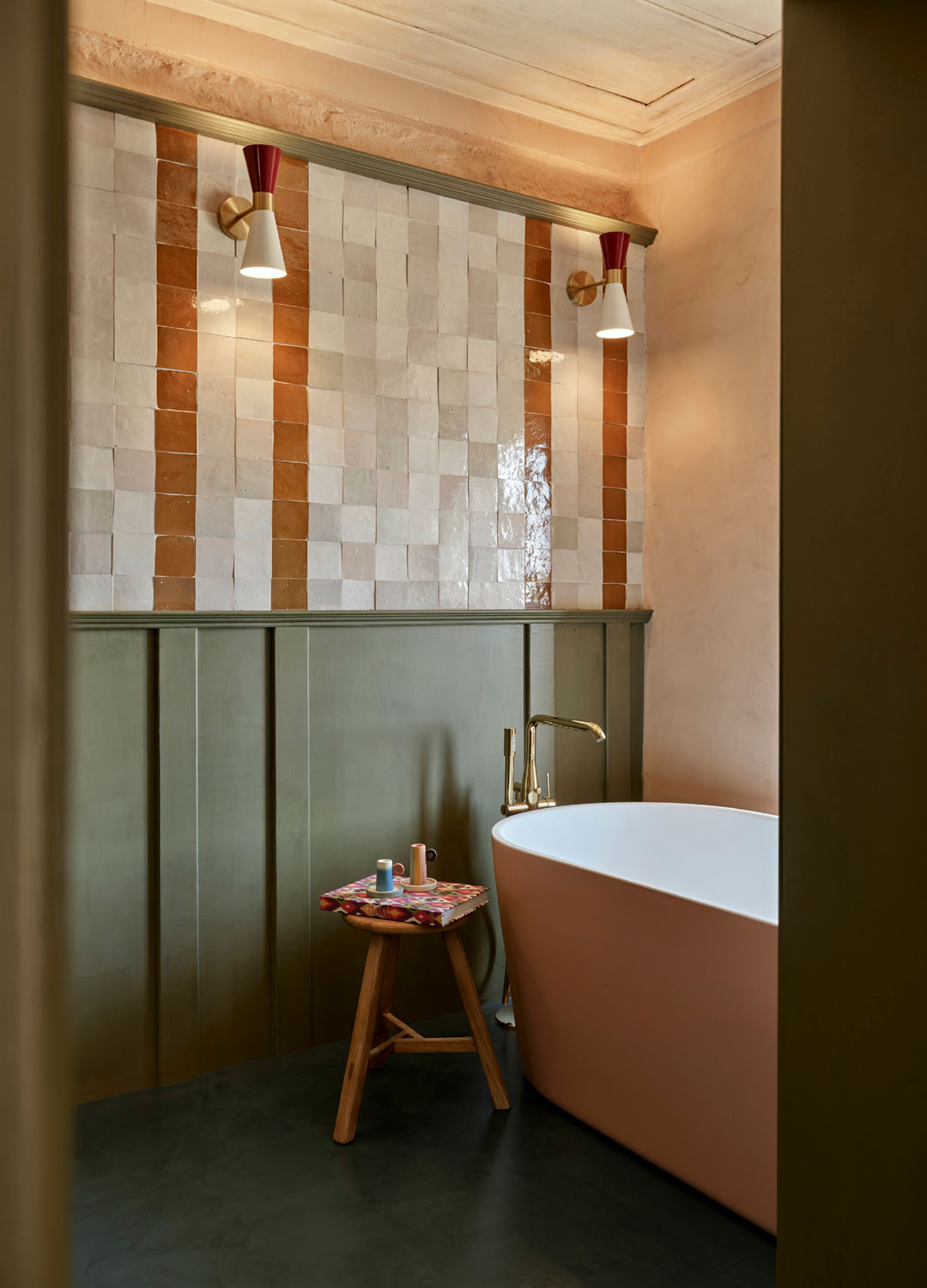 green and pink bathroom with pink bath and green wall panelling