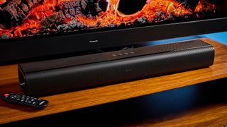 the budget majority naga 60 soundbar in black, showing its buttons and remote