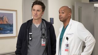 J.D. and Turk standing in a hospital hallway in Scrubs season 10