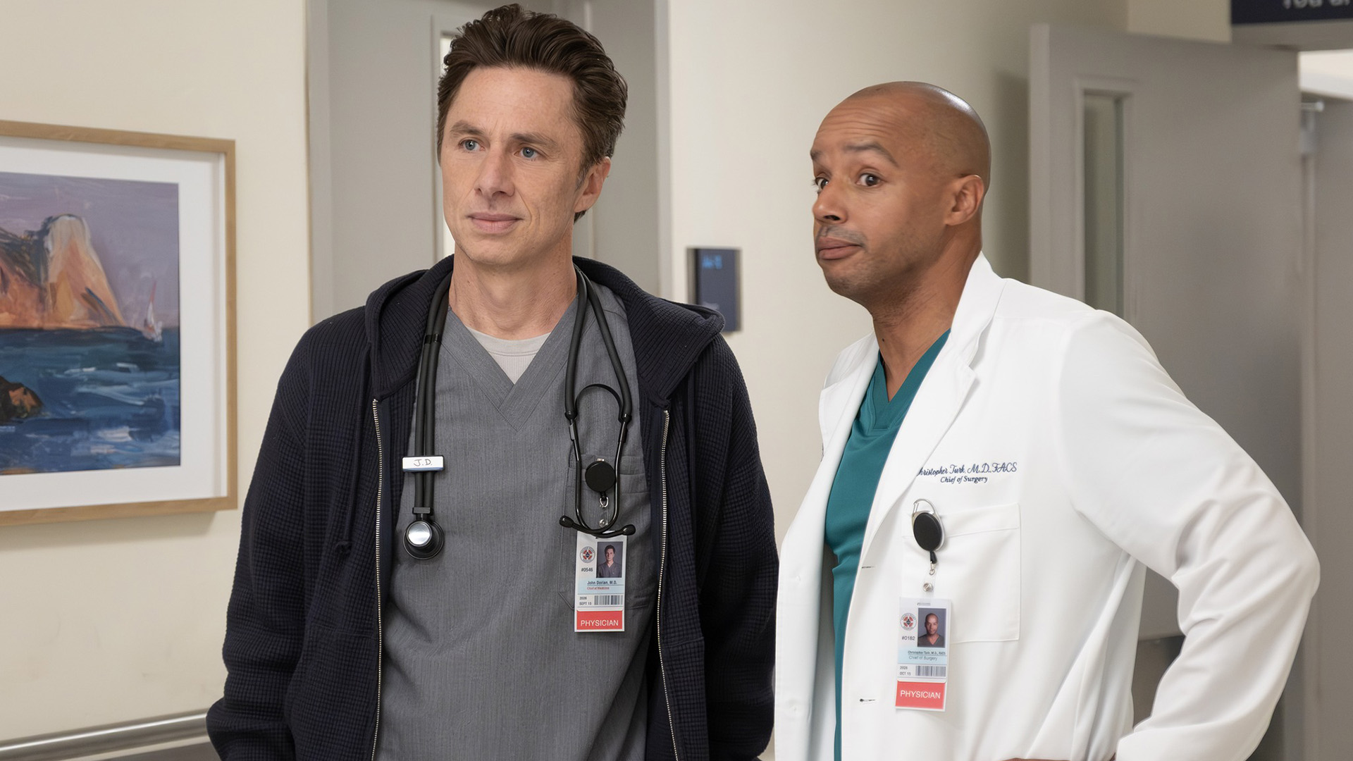 J.D. and Turk standing in a hospital hallway in Scrubs season 10