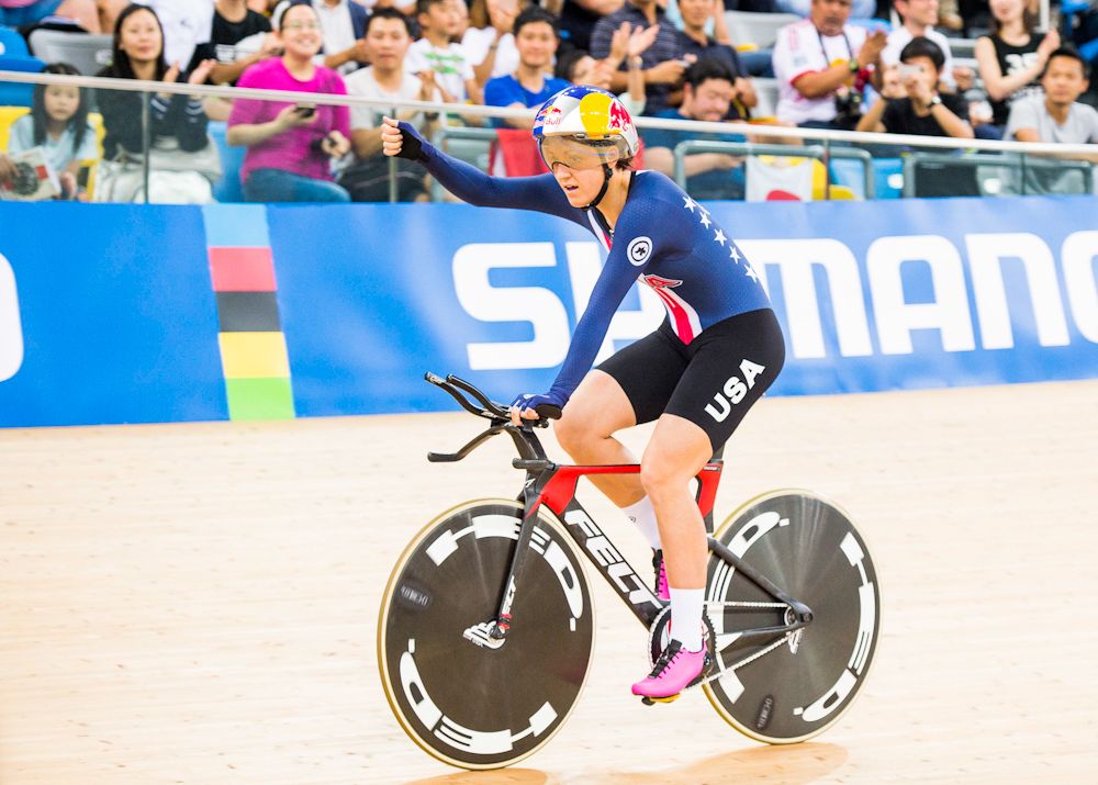 Chloe Dygert celebrates winning the individual pursuit rainbow jersey