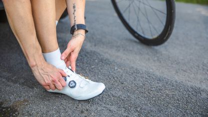 Image shows someones feet in cycling shoes