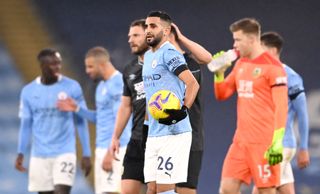 Riyad Mahrez, centre, with the match ball after his hat-trick against Burnley