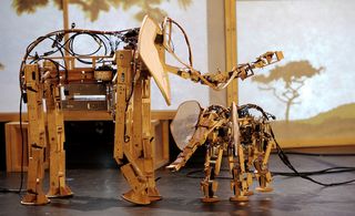 Electronic wooden sculptures of two elephants