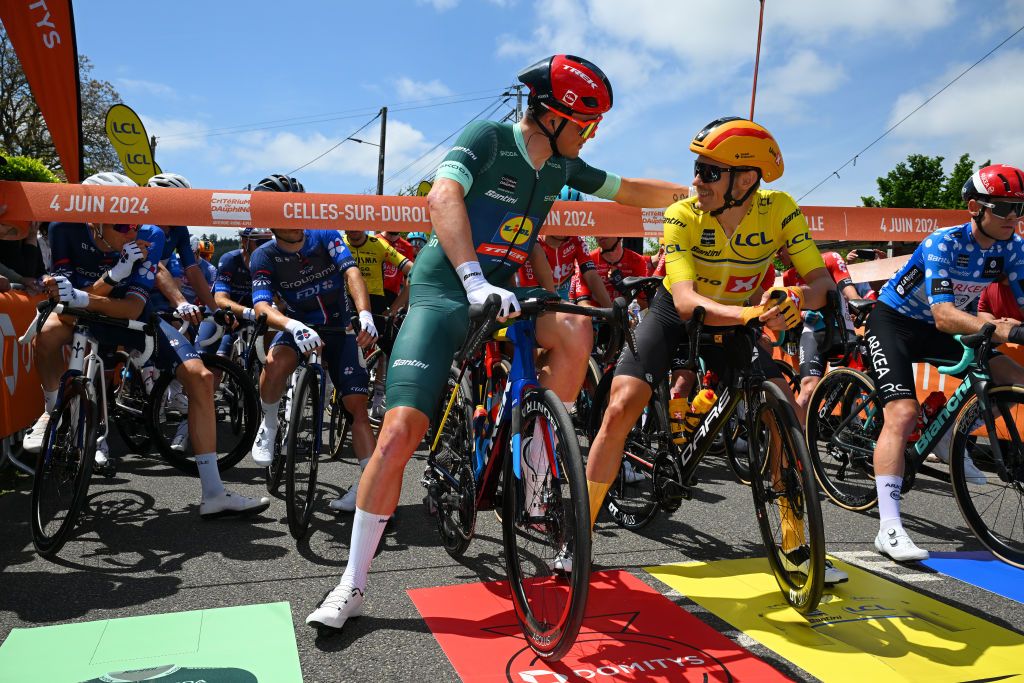 2024 Crit&eacute;rium du Dauphin&eacute;: Mads Pedersen and race leader Magnus Cort wait for the start of stage 3