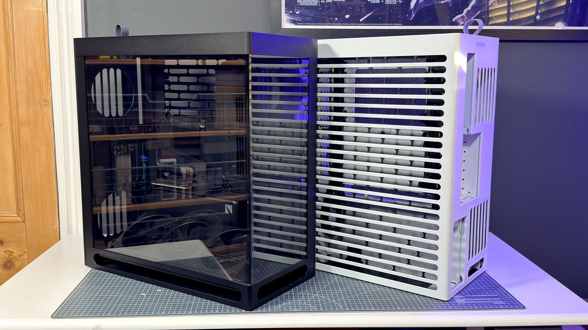 The Havn HS 360 PC case in black and white on a desk.