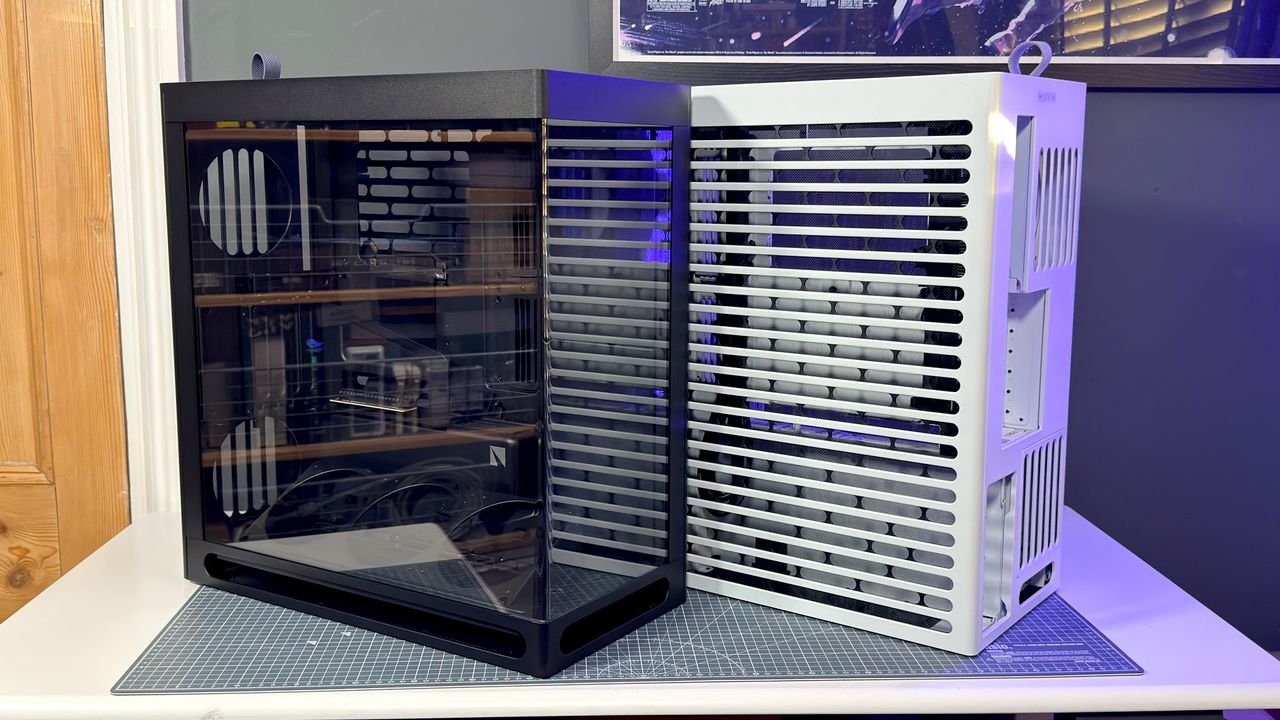 The Havn HS 360 PC case in black and white on a desk.