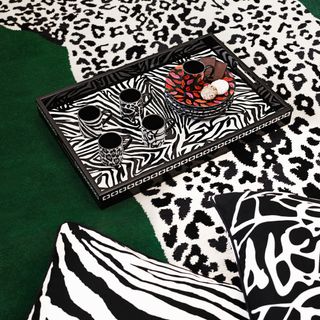 Zebra print tray with four mugs and plates