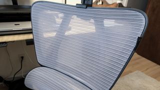 A close up shot of the mesh back of the ProtoArc EC100 office chair