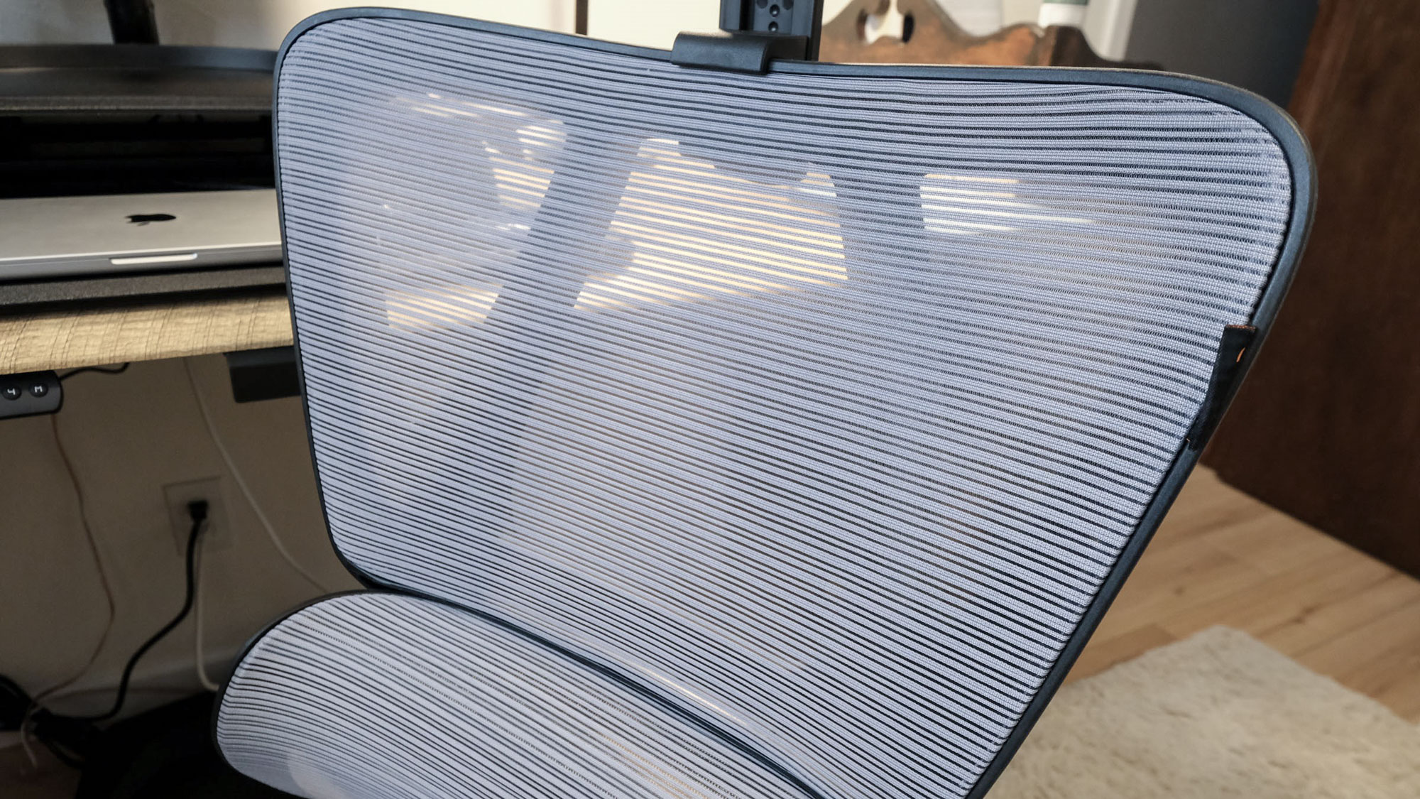 Close-up of the mesh back of the ProtoArc EC100 office chair