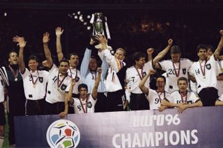 Germany players celebrate with the European Championship trophy at Wembley after winning Euro 96.