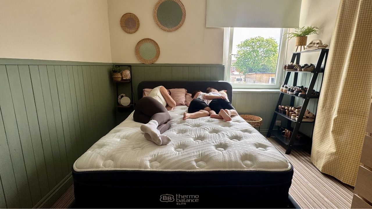 Our mattress reviewer carrying out motion isolation tests on the Brooklyn Bedding Thermobalance LX Elite