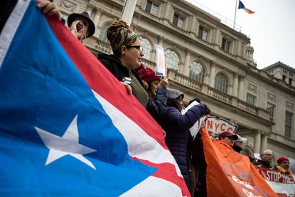 Activists rally in support of Puerto Rican families.