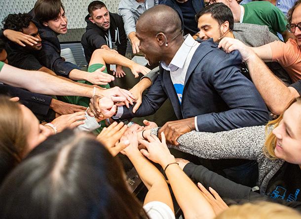 Comcast NBCUniversal LIFT Labs picture of people joining hands