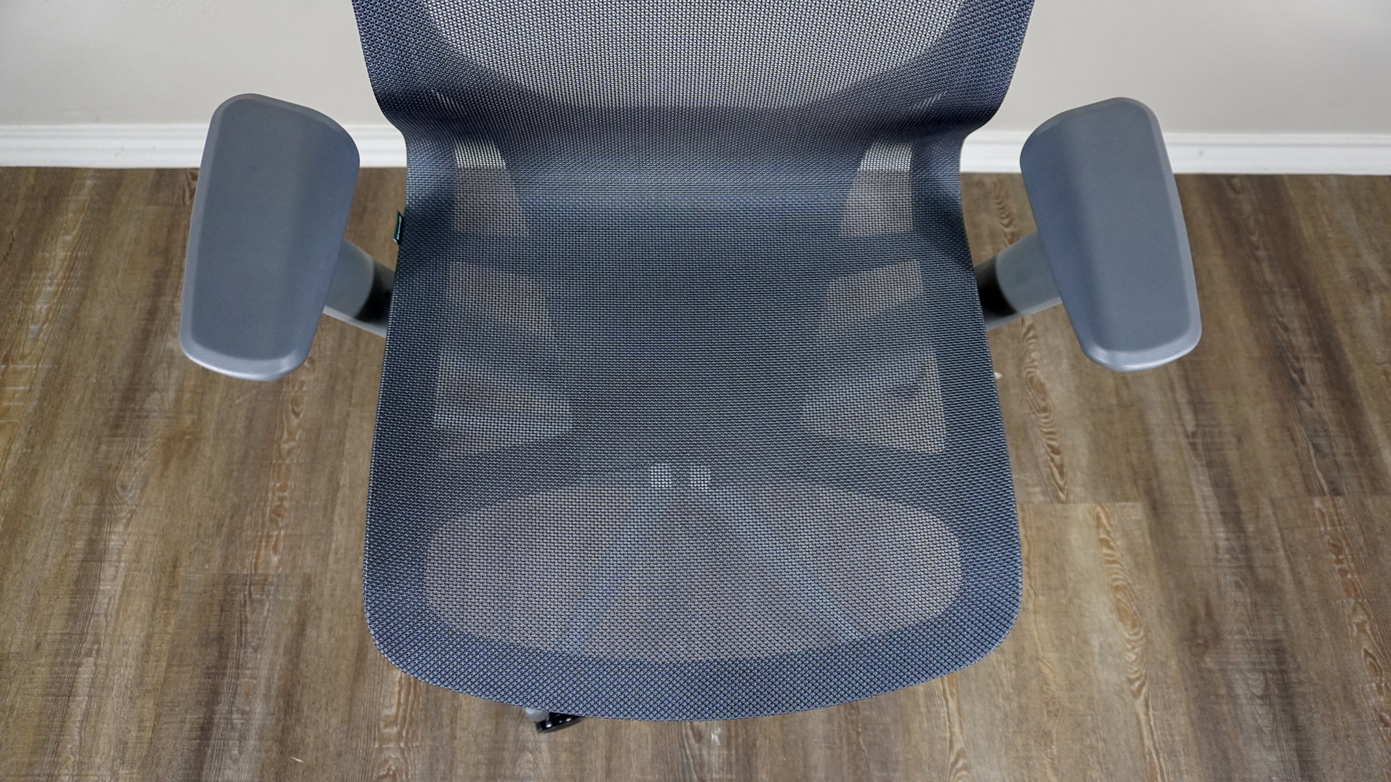 An overhead view of the Branch Aire Chair showing off its mesh seat and 3D armrests