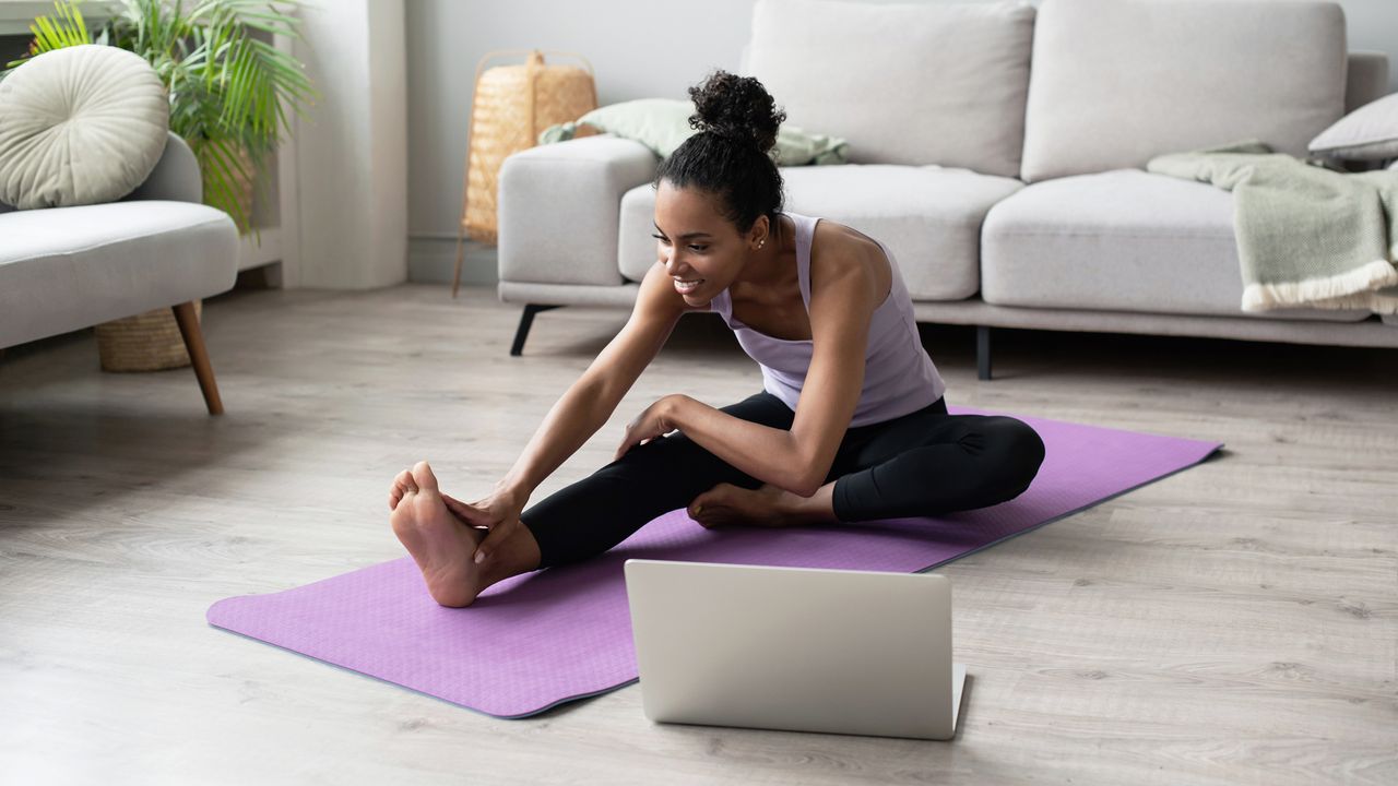 Woman stretching at home