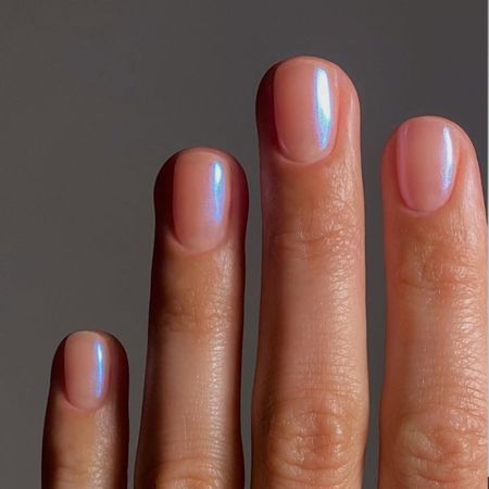 a close-up of blue chrome nails