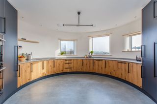 a kitchen with curved walls
