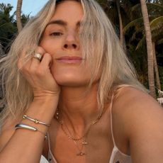 Lucy Williams wears t-bar necklaces stacked up with other dainty jewels.
