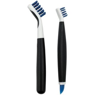 A set of two black narrow cleaning brushes with white heads and blue bristles