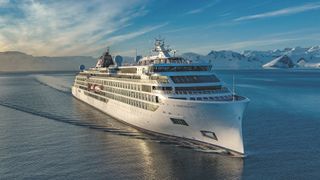 a large sleek cruise ship on the water