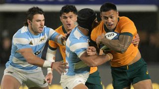 Australia centre Len Ikitau evades a tackle from Argentina&#039;s Santiago Chocobares during the sides&#039; August 2024 Rugby Championship match.