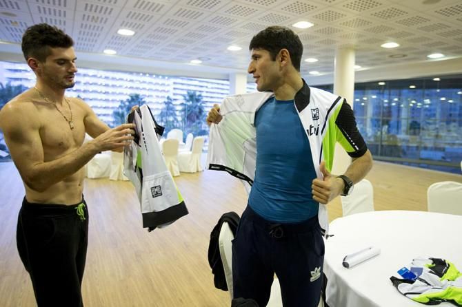 Max Averin and Elchin Asadov try on jerseys for size
