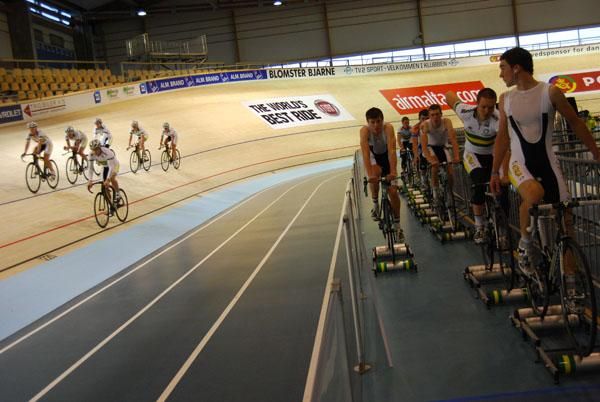 Leigh Howard watches the Australian women's team pursuit squad train from the rollers.