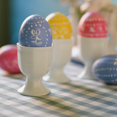 colourful chocolates eggs in white cup