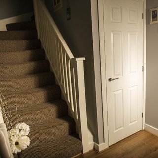 hallway with staircase and door