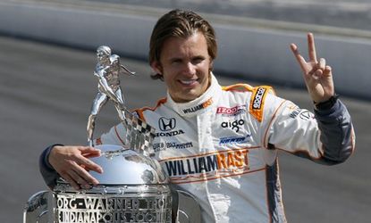 IndyCar drive Dan Wheldon pictured after his Indianapolis 500 win last May: The 33-year-old died Sunday from injuries sustained in a horrific crash at the Las Vegas Motor Speedway.