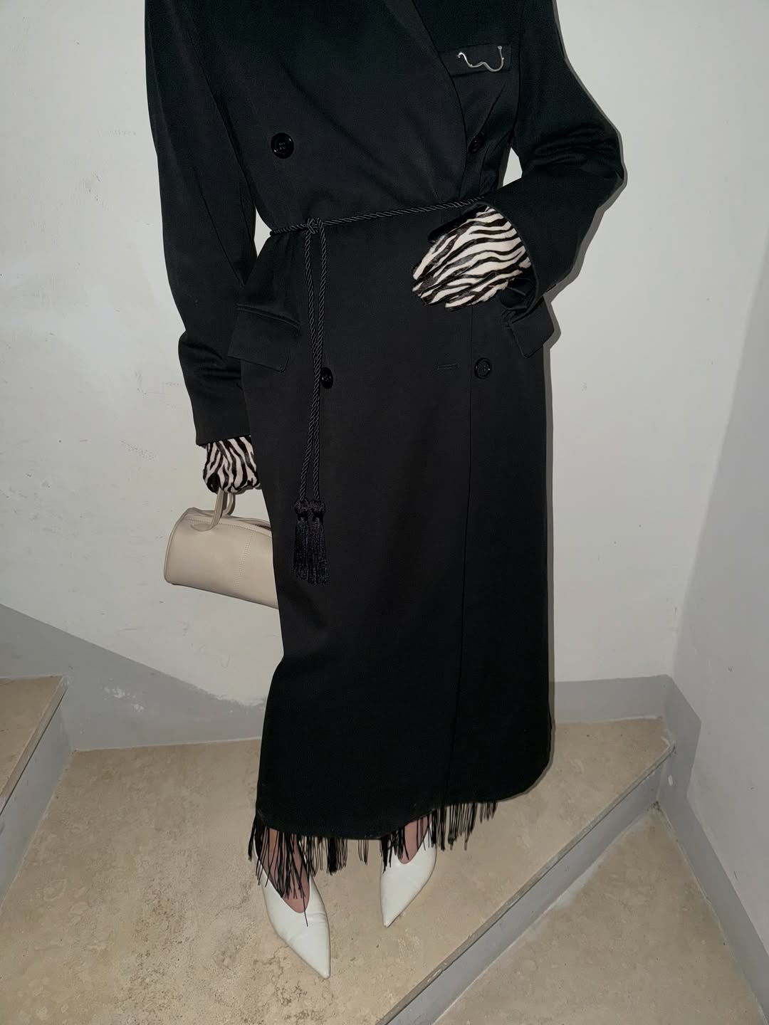 woman wearing statement coat outfit 2026