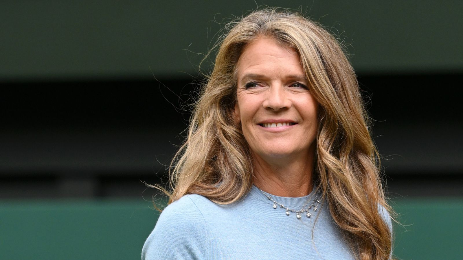 Annabel Croft in blue dress and white trainers