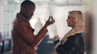 The Doctor holding a needle and standing next to Ruby in Doctor Who season 2