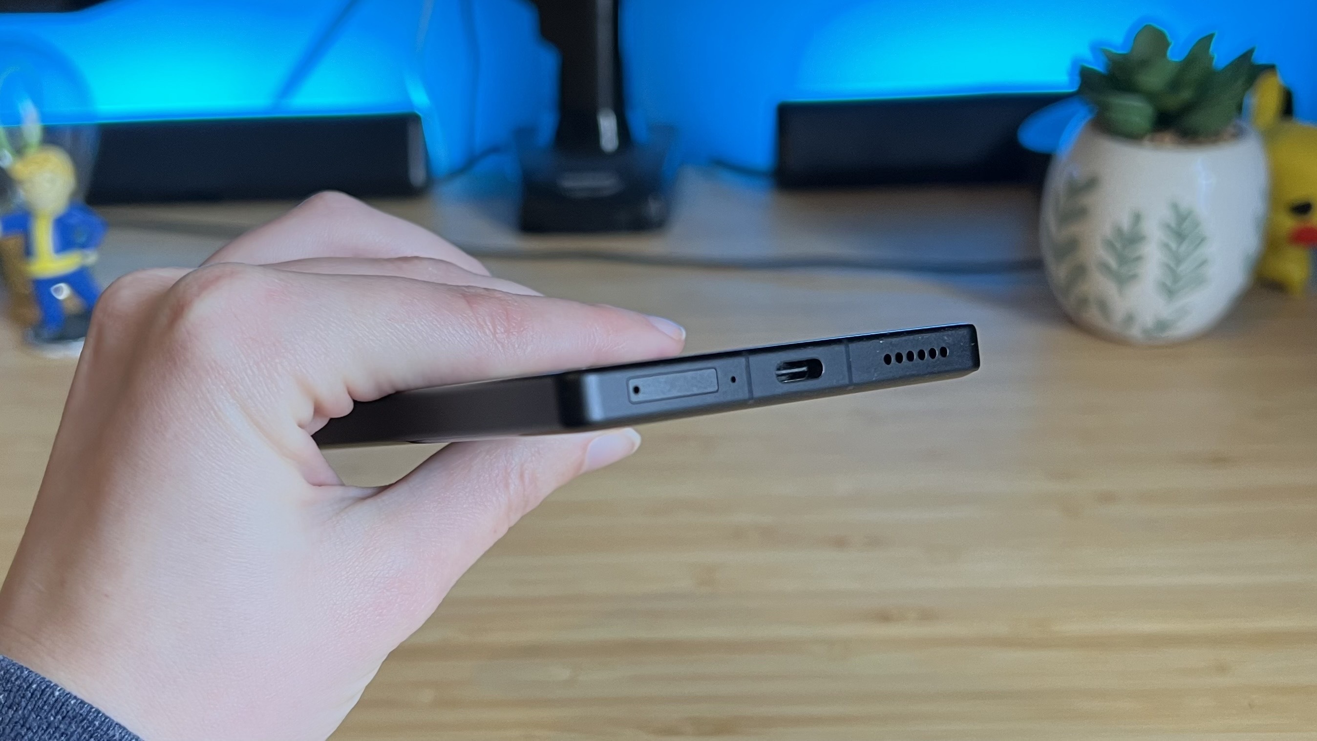 Hand holding RedMagic 11 Air over both sides, showing thickness of handset