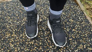 Susan Griffin wearing Keen 450 Dirt walking shoes on tarmac