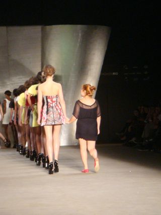 Patacho designer Erika Frade walking off stage with the models