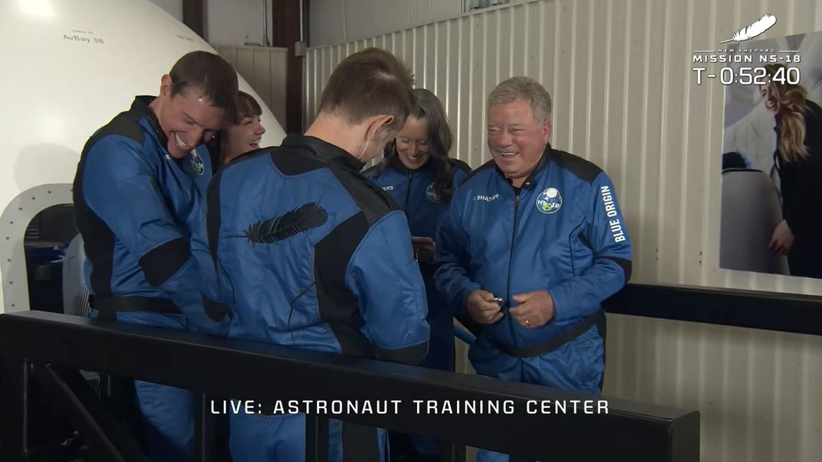 Blue Origin's NS-18 crew, including William Shatner, heads out to the launchpad for their launch into space on Oct. 13, 2021.