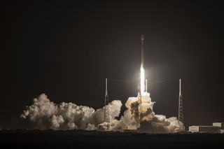 A SpaceX Falcon 9 rocket with a twice-flown first stage launches the Beresheet lunar lander and two other spacecraft from Cape Canaveral Air Force Station in Florida on Feb. 21, 2019.