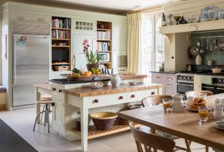 Spacious open plan kitchen with cabinets a mixture of styles from Mark Wilkinson Furniture. The American style fridge freezer is from Sub-Zero