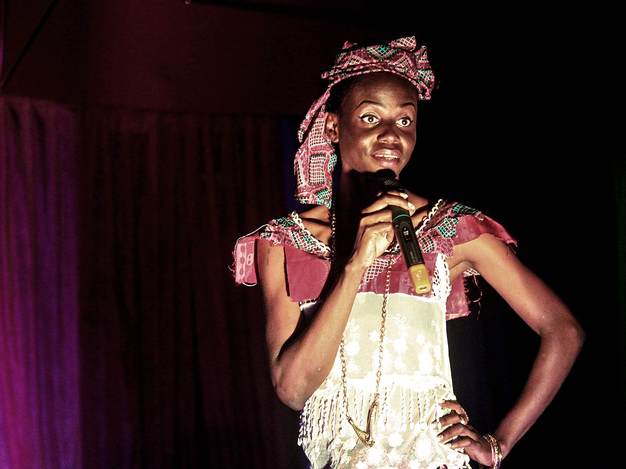 A Congolese pageant contestant talks to the judges